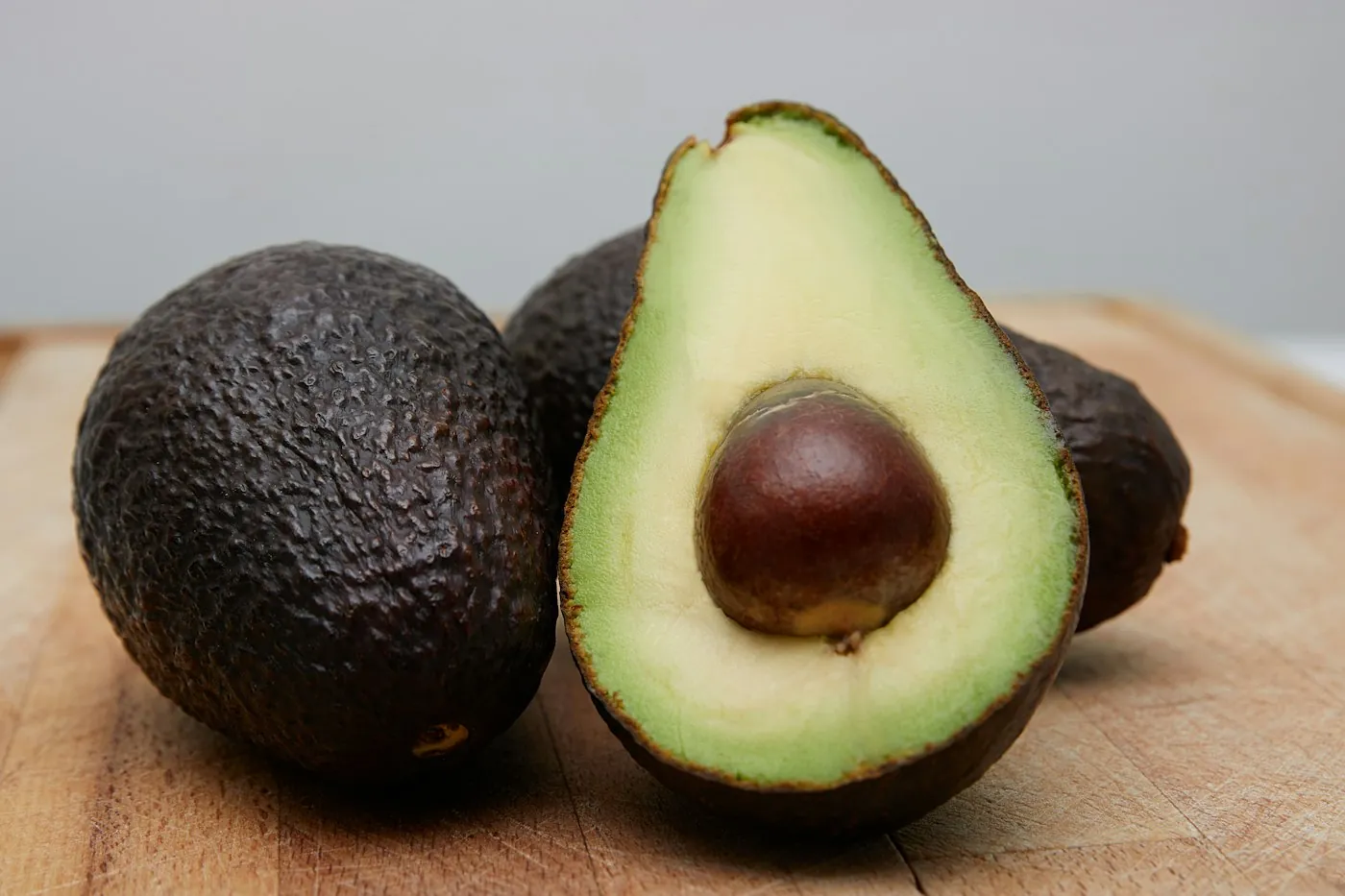 Hass avocados, one cut open